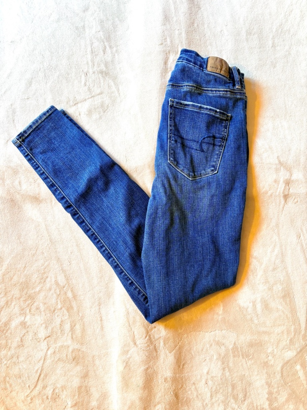AE Distressed Next Level Stretch Curvy Super Hi-Rise Jegging Skinny Jeans
